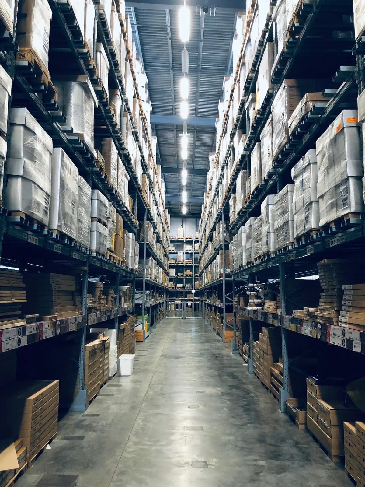 Warehouse racks with stocked pallets